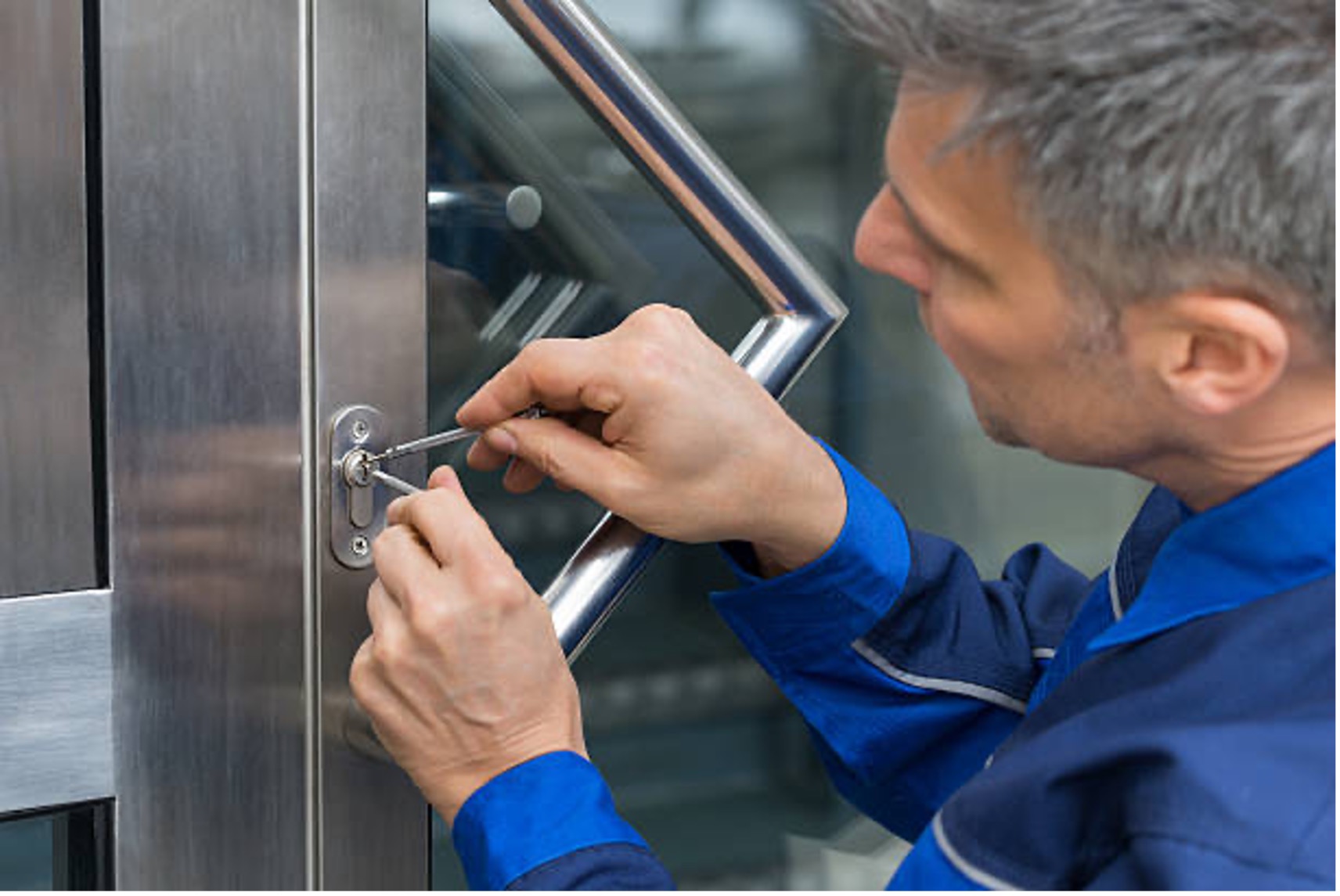 Professional locksmith working on a door lock